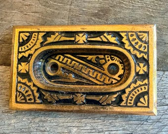 Eastlake style cast iron window sash handle by Bradford