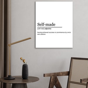 May include: A black and white printable wall art print with the definition of the word "self-made". The definition reads "{self-mad} adjective having achieved success or prominence by one's own actions".