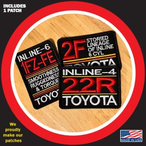 May include: Three black embroidered patches with red and white text. The patches feature the text "INLINE-6 1FZ-FE", "2F STORIED LINEAGE OF INLINE 6 CYL", and "INLINE-4 22R TOYOTA". The patches are on a wooden surface.