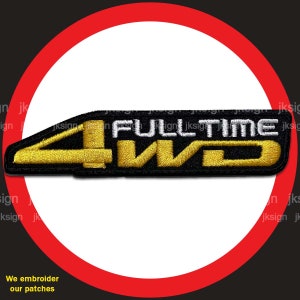 May include: Black and gold embroidered patch with the text "FULLTIME 4WD" in white lettering.