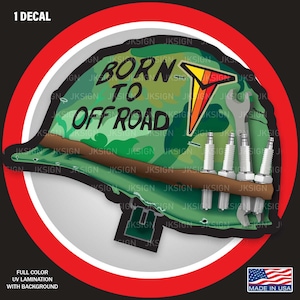 May include: A green camouflage helmet with the words "Born to Off Road" and a red, yellow, and orange arrow graphic. The helmet has a wrench and spark plugs on the side. The helmet is surrounded by a red circle with a white outline.