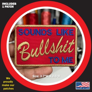 May include: Red embroidered patch with gold lettering that reads "Sounds Like Bullshit To Me". The patch is 3.7 inches wide and 2.5 inches high.