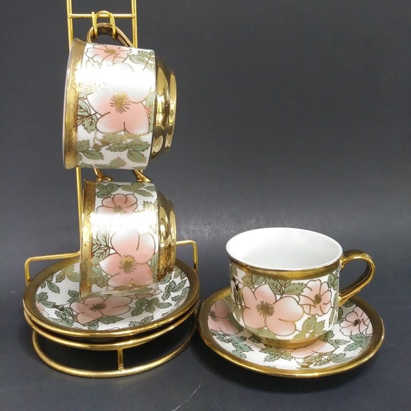 Elegant Floral Teacup and Saucer Set with Gold Trim and Metal Holder