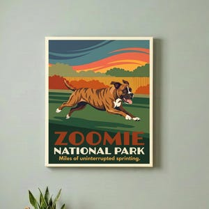 May include: A rectangular wall poster featuring a brown and white boxer dog running across a green field under a sunset sky. The text reads ZOOMIE NATIONAL PARK Miles of uninterrupted sprinting. The art style uses bold colors and flat shapes.