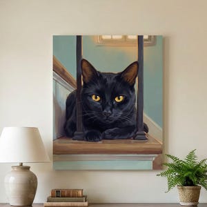 May include: A square canvas wall art print featuring a black cat with bright yellow eyes resting on a wooden staircase landing between dark vertical railings. The painting is displayed on a light-colored wall above a wooden console table.