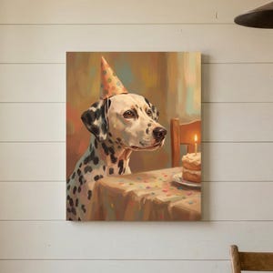 May include: A square wall art print featuring a painting of a Dalmatian dog wearing a polka-dot party hat. The dog sits at a table with a small birthday cake topped with a single lit candle. The color palette includes warm browns, creams, and black.