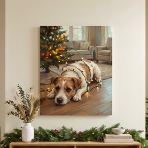 May include: A rectangular wall art print featuring a brown and white Jack Russell Terrier lying on a wooden floor, wrapped in glowing string lights, with a Christmas tree in the background. The print is displayed above a wooden media console.
