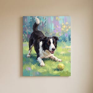 May include: A rectangular wall art print featuring a black and white Border Collie in a play bow stance on a green grassy field with a yellow tennis ball. The background shows soft, colorful floral shapes in shades of purple and yellow.