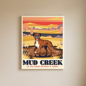May include: A rectangular wall art print featuring a brindle boxer dog standing in a muddy puddle. The background shows a stylized landscape with a sunset sky. The text reads MUD CREEK and UP THE CREEK WITHOUT A TOWEL in dark blue and red.