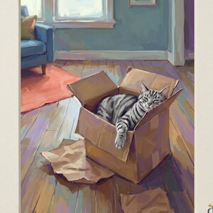 May include: A digital illustration titled Heirloom Tails Collection featuring a grey tabby cat resting inside a brown cardboard box on a wooden floor. The scene includes a blue armchair and a red rug in the background. Text reads Heirloom Tails Collection and Digital Download.
