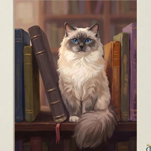 May include: A digital illustration titled HEIRLOOM TAILS COLLECTION featuring a fluffy cream and grey cat with bright blue eyes sitting on a shelf between several upright hardcover books. The text DIGITAL DOWNLOAD appears at the bottom.