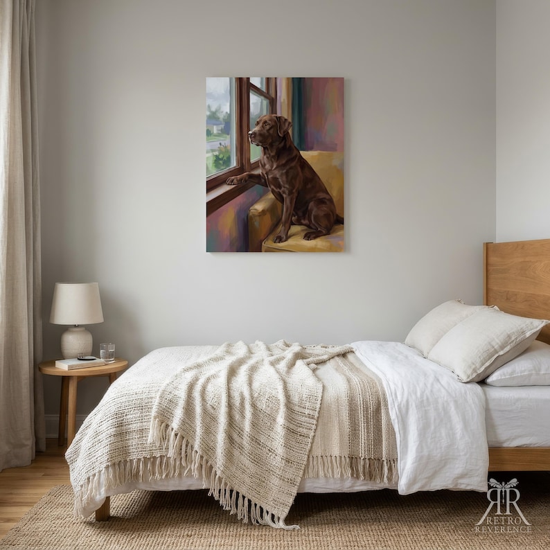 May include: A rectangular wall art print featuring a chocolate Labrador retriever sitting on a yellow armchair, looking out of a window. The dog is brown with a smooth coat, positioned in profile. The background shows a soft, painterly interior scene.