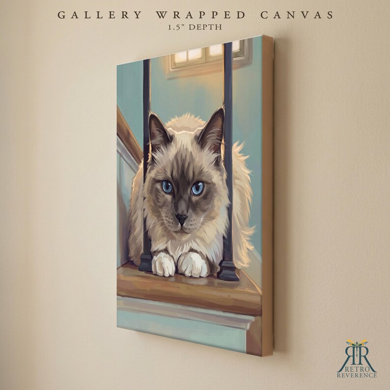 May include: A gallery wrapped canvas with a 1.5 inch depth featuring a digital illustration of a fluffy, cream and brown colored cat with bright blue eyes sitting on a wooden staircase behind dark vertical railings in a soft indoor setting.