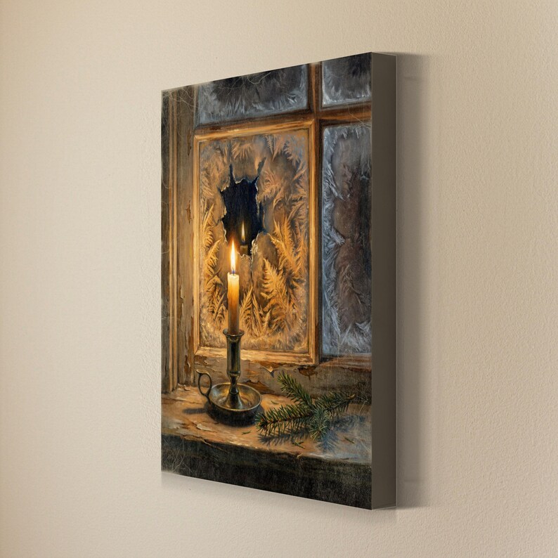 May include: A rectangular canvas wall art print depicting a lit candle in a metal holder on a wooden windowsill. The windowpane behind the candle features intricate frost patterns and a clear circular opening, with a small pine branch nearby.