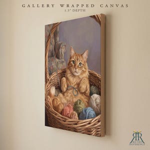 May include: A gallery wrapped canvas with a 1.5 inch depth featuring a painting of an orange tabby cat sitting inside a woven wicker basket filled with various colorful balls of yarn. The text GALLERY WRAPPED CANVAS 1.5" DEPTH is visible.