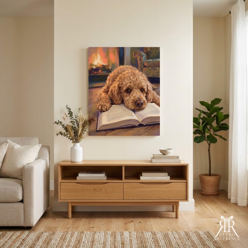 May include: A wall-mounted canvas print depicting a curly-haired golden dog resting its head on an open book. The background shows a warm, glowing fireplace and a cozy armchair, creating a serene atmosphere within the painted scene.