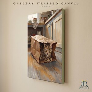 May include: A gallery wrapped canvas with a 1.5 inch depth featuring a painting of a brown tabby cat sitting inside a brown paper grocery bag on a wooden floor in a kitchen setting with cabinets and various kitchen items visible in the background.
