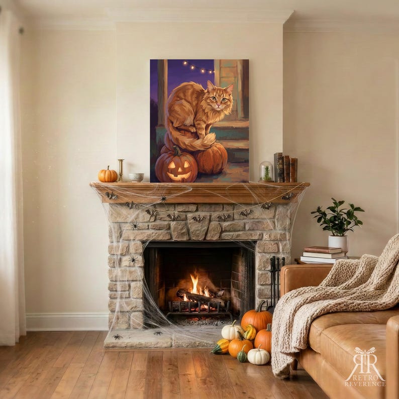 May include: A rectangular wall art print featuring an orange cat sitting on a carved jack-o'-lantern pumpkin. The artwork displays a purple twilight sky, string lights, and wooden porch steps. The print is displayed above a stone fireplace.