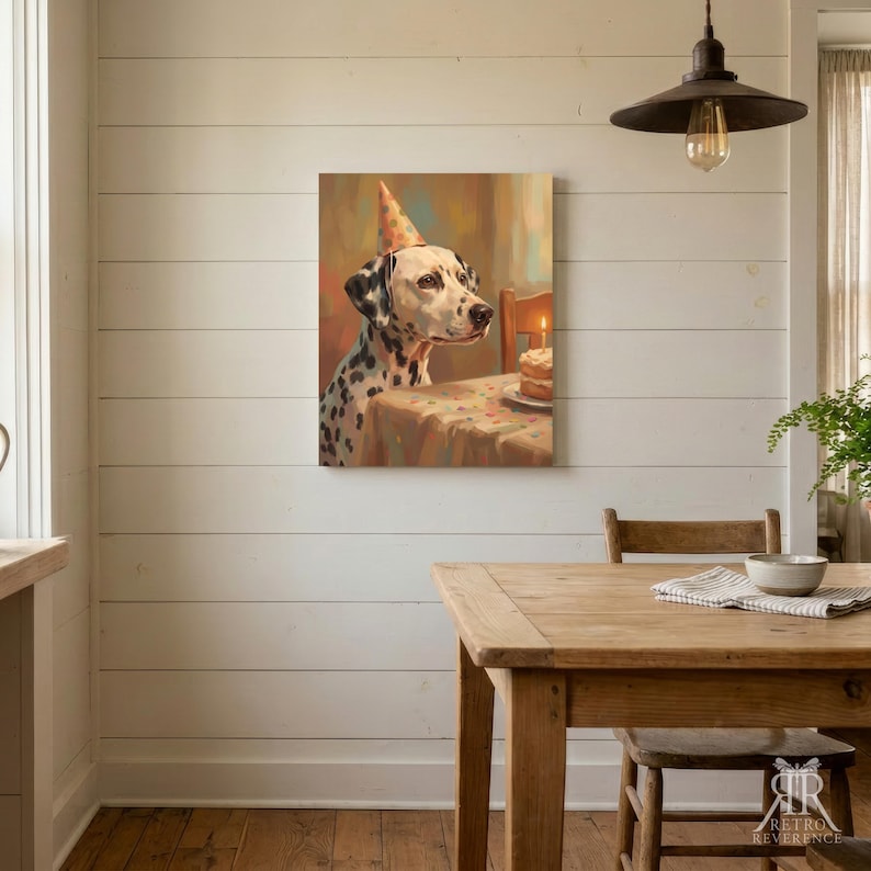 May include: A square wall art print featuring a painting of a Dalmatian dog wearing a polka-dot party hat. The dog sits at a table with a small birthday cake topped with a single lit candle. The color palette includes warm browns, creams, and black.