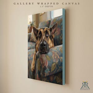 May include: A gallery wrapped canvas with a 1.5 inch depth featuring a painting of a German Shepherd dog resting its head on a floral patterned sofa. The dog has black and tan fur and is looking upward. The text reads GALLERY WRAPPED CANVAS.