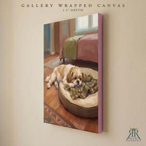 May include: A gallery wrapped canvas with a 1.5 inch depth featuring a painting of a brown and white dog resting on a round beige bed with a plaid blanket. The scene depicts a bedroom interior with a bed and wooden floor. Text reads GALLERY WRAPPED CANVAS.
