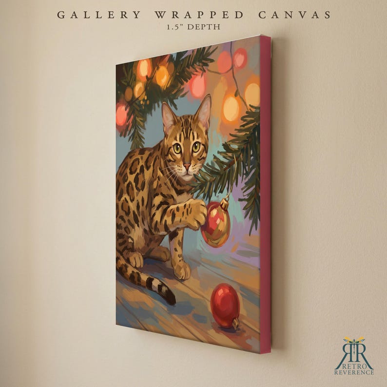 May include: A gallery wrapped canvas with a 1.5 inch depth featuring a painting of a spotted brown cat playing with a red Christmas ornament under pine branches with glowing orange lights. The text GALLERY WRAPPED CANVAS 1.5" DEPTH is visible.