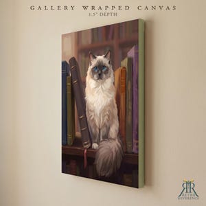 May include: A gallery wrapped canvas with a 1.5 inch depth featuring a digital illustration of a long-haired cat with blue eyes sitting on a wooden shelf among several upright books. The text GALLERY WRAPPED CANVAS 1.5" DEPTH is visible.