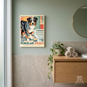 May include: A rectangular wall art print featuring a blue merle Australian Shepherd standing next to a white toilet on a blue and white checkered floor. The text reads PORCELAIN SPRINGS and Fresh water, no reservation required. The background is orange.