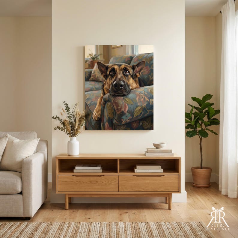 May include: A rectangular wall art print featuring a German Shepherd dog resting its chin on the arm of a floral patterned sofa. The dog has black and tan fur, pointed ears, and brown eyes. The artwork is displayed in a home interior setting.