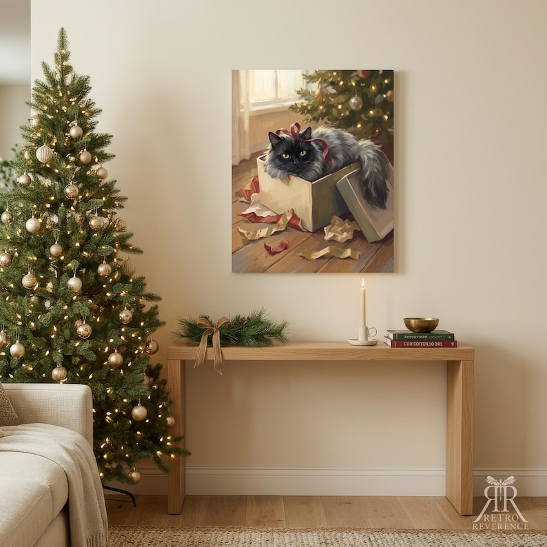May include: A rectangular wall art print depicting a fluffy black cat with yellow eyes sitting inside an open cardboard gift box. The cat has a red ribbon around its neck. The scene includes scattered wrapping paper on a wooden floor near a Christmas tree.
