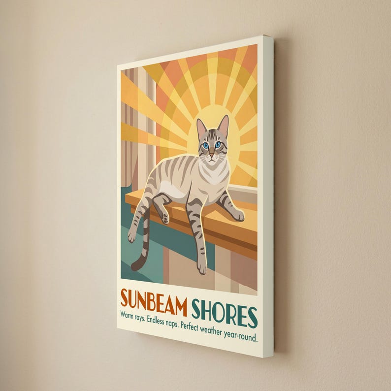 May include: A rectangular wall art print featuring a light brown tabby cat resting on a ledge against a yellow sunburst background. The text SUNBEAM SHORES is printed at the bottom, followed by the words Warm rays. Endless naps. Perfect weather year-round.