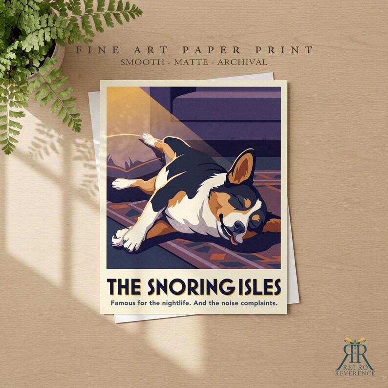 May include: A fine art paper print featuring a stylized illustration of a tricolor dog sleeping on a rug. The text reads THE SNORING ISLES, Famous for the nightlife. And the noise complaints. The print is smooth, matte, and archival quality.