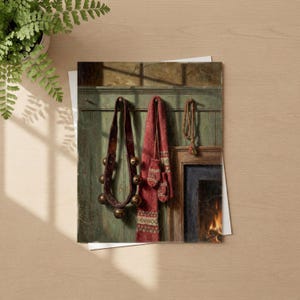 May include: A rectangular print featuring a dark green wooden wall with a leather strap holding brass bells, a red patterned scarf with matching mittens, and a thin cord hanging beside a fireplace with visible flames and glowing embers.
