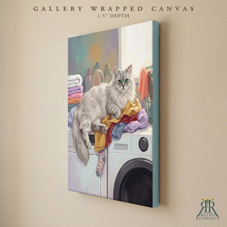 May include: A gallery wrapped canvas with a 1.5 inch depth featuring a digital illustration of a long-haired white cat with green eyes resting on a pile of colorful laundry atop a white washing machine, with stacked towels and bottles nearby.