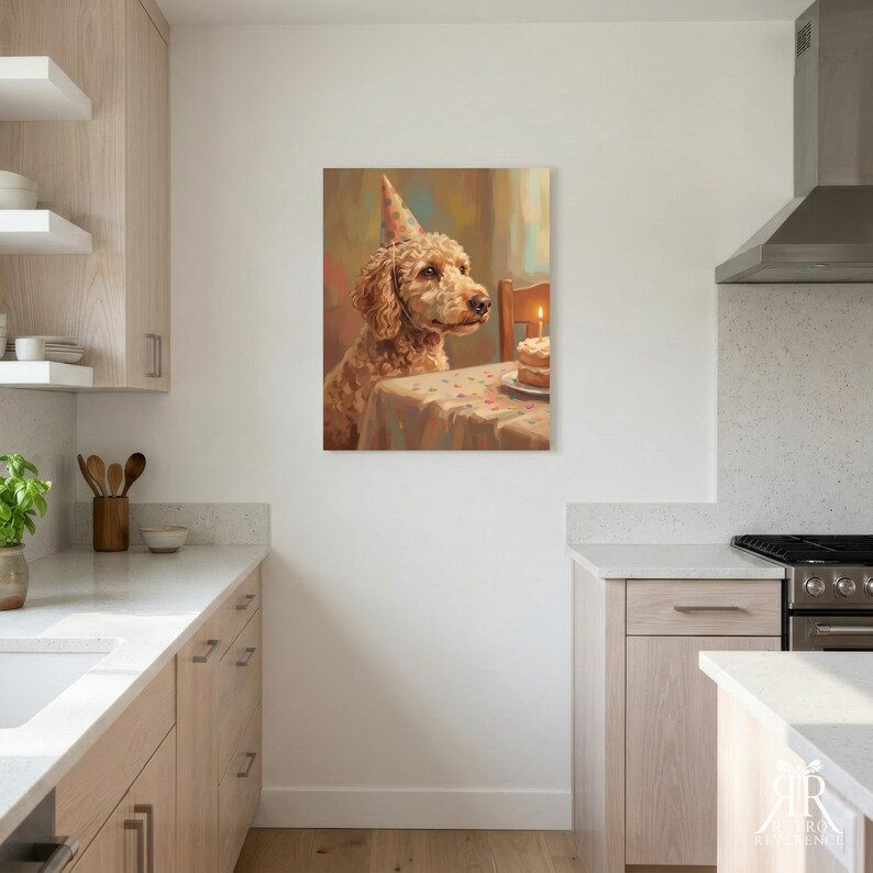 May include: A wall art print depicting a golden-brown curly-haired dog wearing a polka-dot party hat, sitting at a table with a small birthday cake featuring a single lit candle. The artwork uses a soft, painterly style with warm, muted tones.