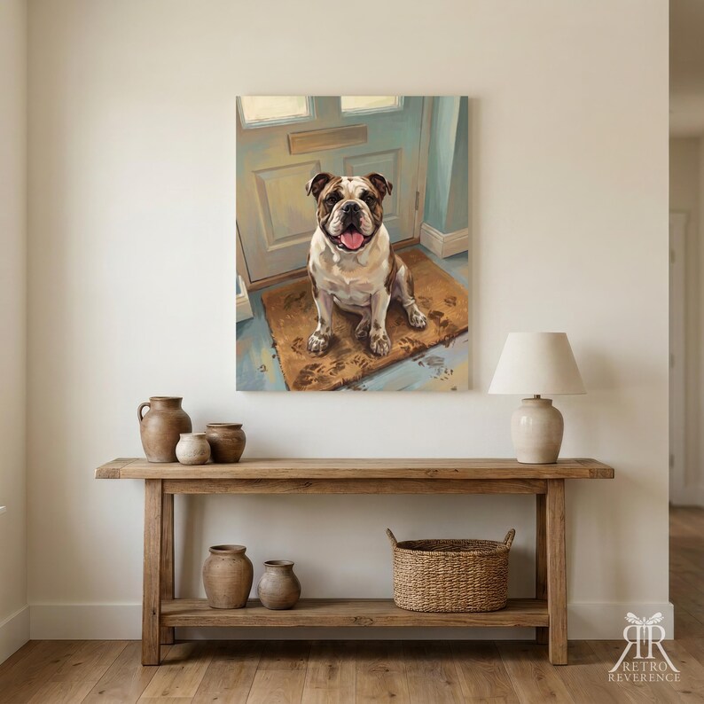 May include: A rectangular wall art print featuring a brown and white bulldog sitting on a doormat in front of a light blue door. The dog has its tongue out. The print is displayed above a wooden console table with ceramic vases and a woven basket.