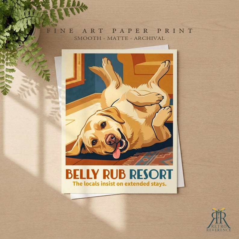 May include: A fine art paper print featuring a yellow Labrador retriever lying on its back with its tongue out. The text reads BELLY RUB RESORT and The locals insist on extended stays. The print is smooth, matte, and archival quality.