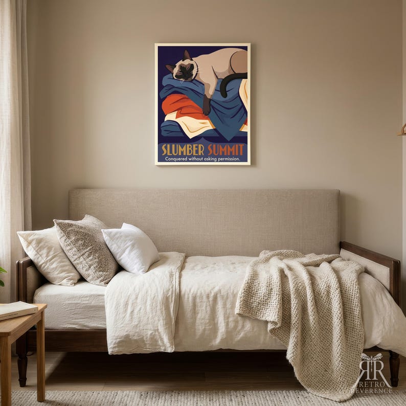 May include: A rectangular wall art print featuring a Siamese cat sleeping on a pile of folded blankets. The text reads SLUMBER SUMMIT and Conquered without asking permission. The color palette includes deep blue, orange, cream, and dark brown tones.