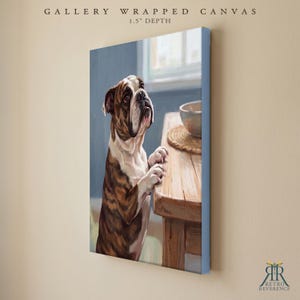 May include: A gallery wrapped canvas with a 3.8 cm depth featuring a painting of a brown and white bulldog standing on its hind legs, resting its front paws on a wooden table next to a bowl. The text reads GALLERY WRAPPED CANVAS 1.5" DEPTH.