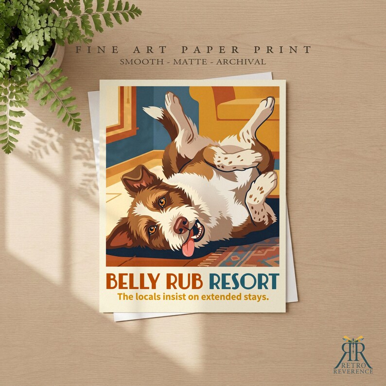 May include: A fine art paper print featuring a brown and white dog lying on its back with its tongue out. The text reads BELLY RUB RESORT and The locals insist on extended stays. The print is smooth, matte, and archival quality.