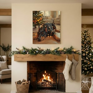 May include: A rectangular wall art print featuring a black and tan Doberman dog lying on a wooden floor, draped in glowing string lights, with a decorated Christmas tree and living room furniture visible in the background scene.