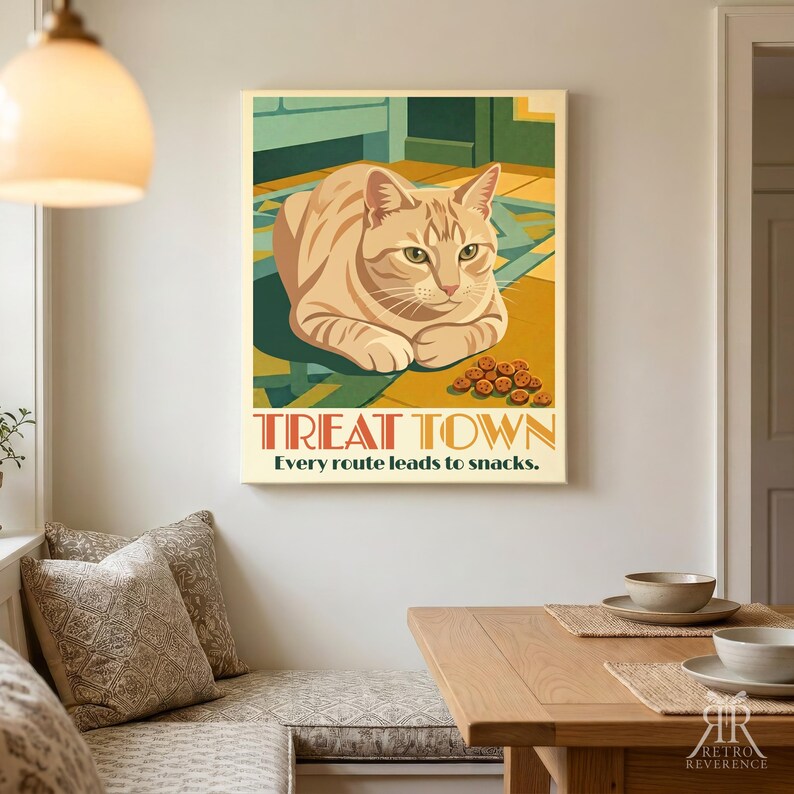 May include: A rectangular wall art print featuring a ginger tabby cat lying on a geometric floor. The text reads TREAT TOWN and Every route leads to snacks. The illustration uses warm yellow, orange, and teal tones with small brown treats.