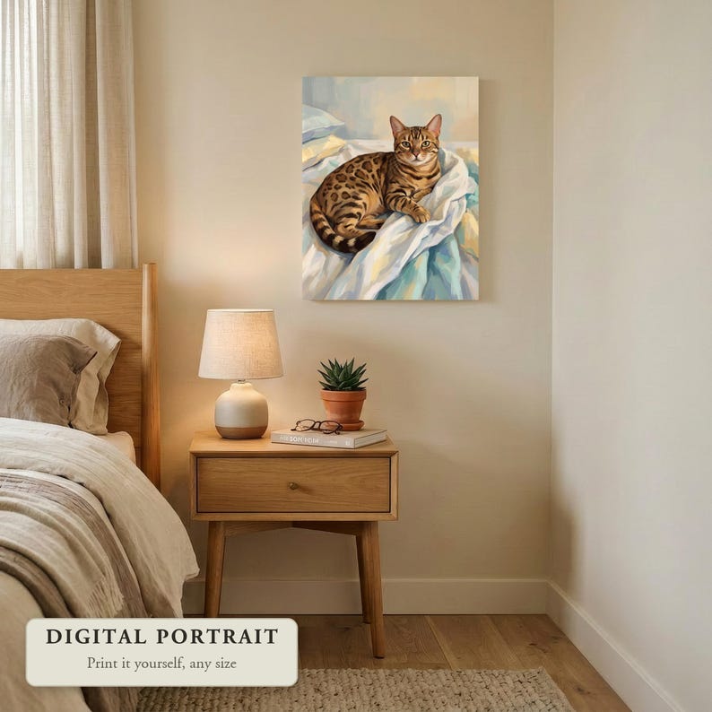 Custom cat portrait of a cat lying on an unmade bed, hung on a wall in a bedroom, shown as a digital file you print yourself