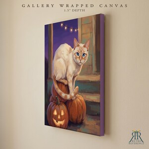 May include: A gallery wrapped canvas with a 1.5 inch depth featuring a painting of a cream-colored cat with blue eyes sitting on orange pumpkins. One pumpkin is a carved jack-o'-lantern with a glowing face. The scene is set on a porch at night.