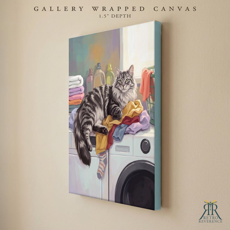 May include: A gallery wrapped canvas with a 1.5 inch depth featuring a digital illustration of a grey tabby cat resting on a white washing machine atop a pile of colorful laundry, including folded towels and a single striped sock.