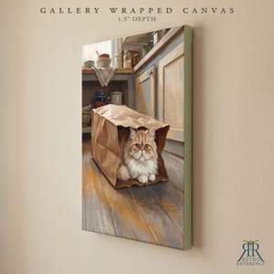 May include: A gallery wrapped canvas with a 1.5 inch depth featuring a painting of a fluffy ginger and white cat sitting inside a brown paper bag on a wooden floor in a kitchen setting with cabinets and kitchenware visible in the background.