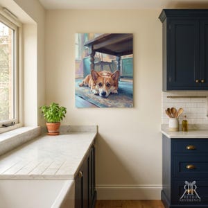 May include: A rectangular wall art print featuring a painting of a tan and white Corgi dog lying on a floor beneath a wooden table. The artwork displays a kitchen scene with soft lighting, visible brushstrokes, and a warm, inviting color palette.