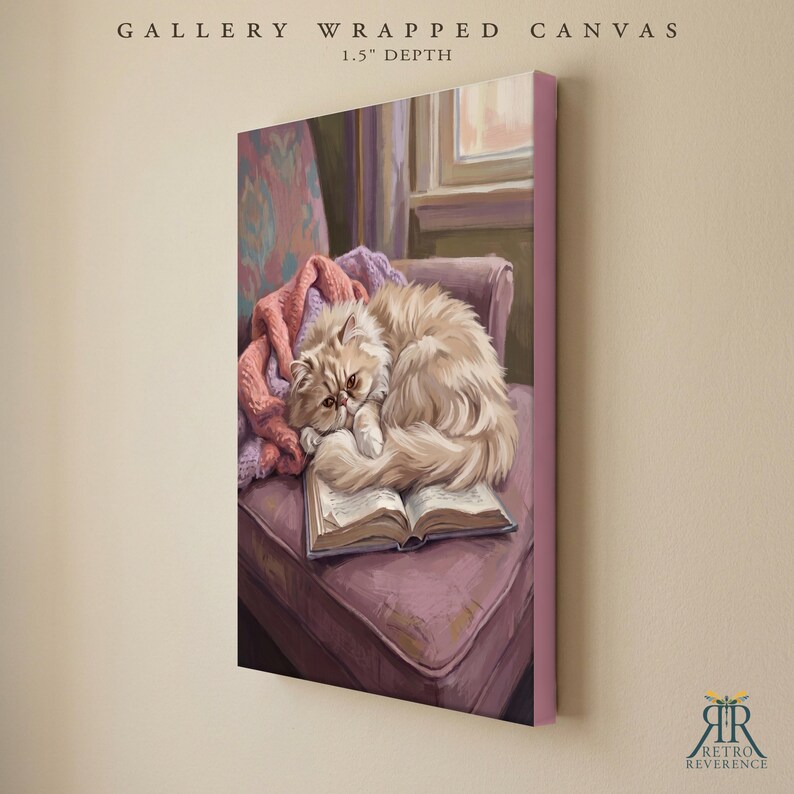 May include: A gallery wrapped canvas with a 1.5 inch depth featuring a painting of a fluffy cream-colored cat curled up asleep on an open book. The cat rests on a mauve armchair draped with a pink knitted blanket, with a window visible in the background.