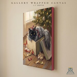 May include: A gallery wrapped canvas with a 1.5 inch depth featuring a painting of a fluffy black cat with yellow eyes sitting inside a cardboard gift box. The cat has a red ribbon around its neck. A Christmas tree with lights is in the background.