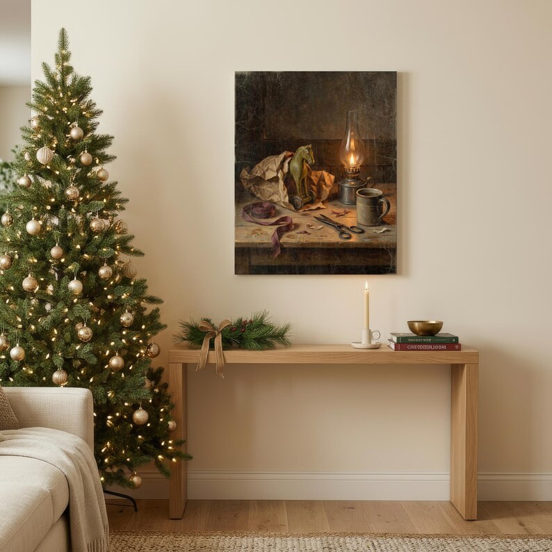 May include: A rectangular wall art print depicting a still life scene with a green toy horse, a lit oil lamp, a ceramic mug, and scissors on a wooden table. The artwork features dark, moody tones and is displayed above a light wood console table.